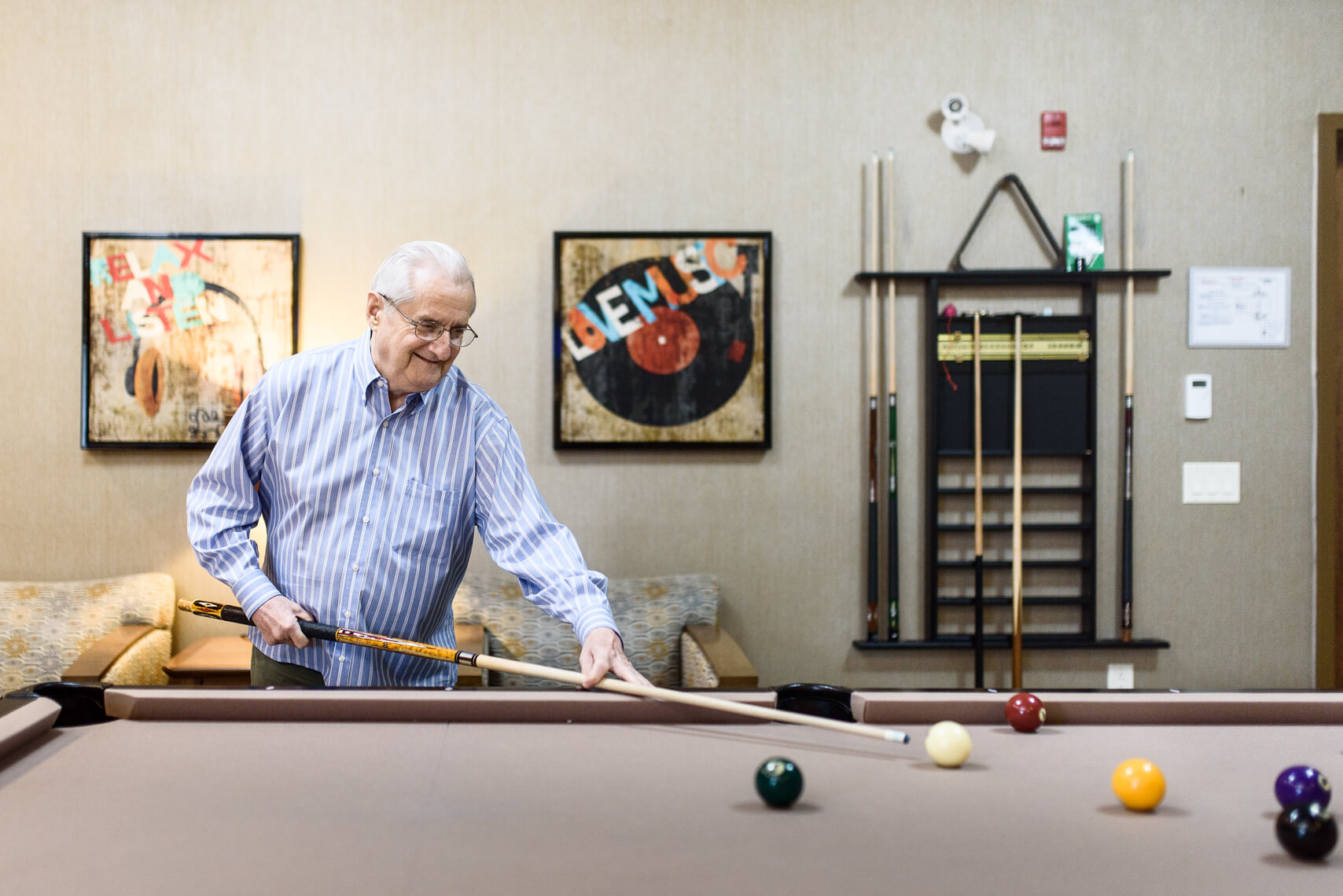 Roger Hunter, resident at Parkland Saint John playing pool.