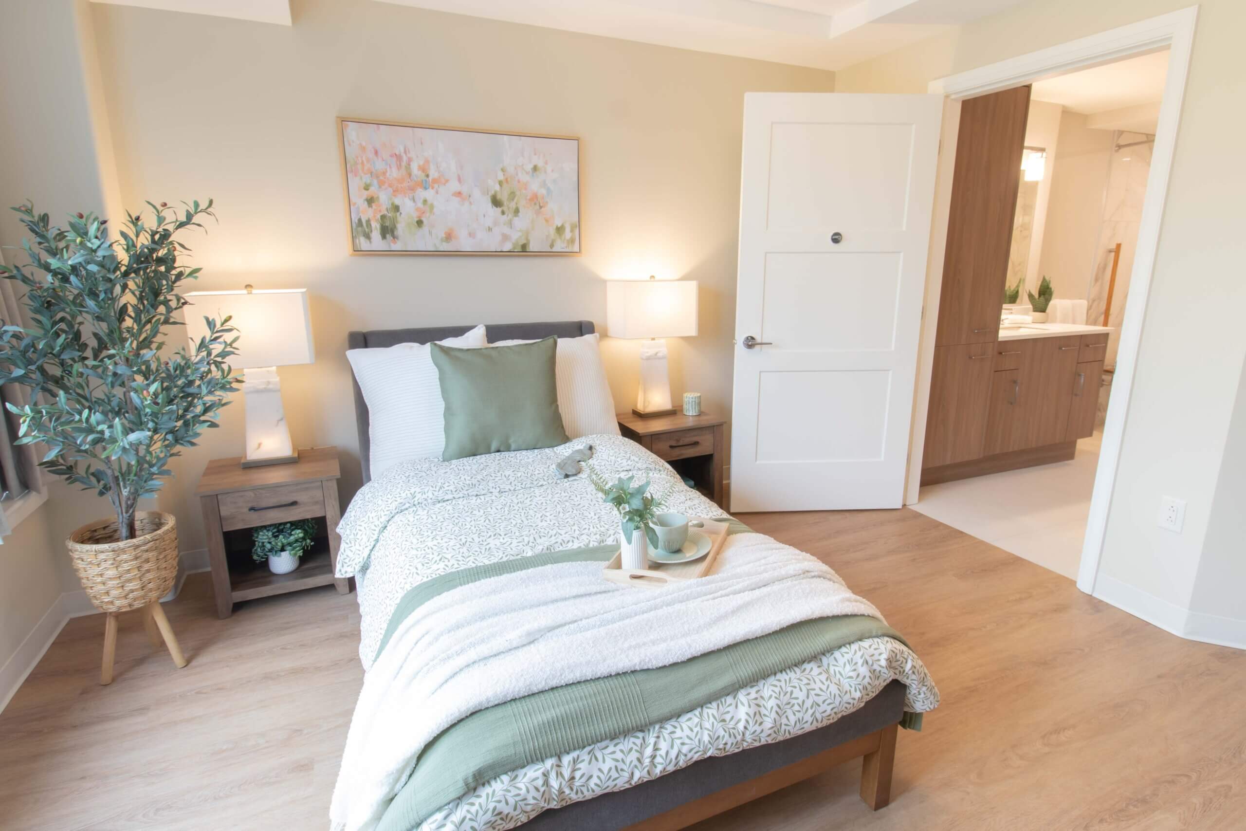 A bed with a left bed-side table.