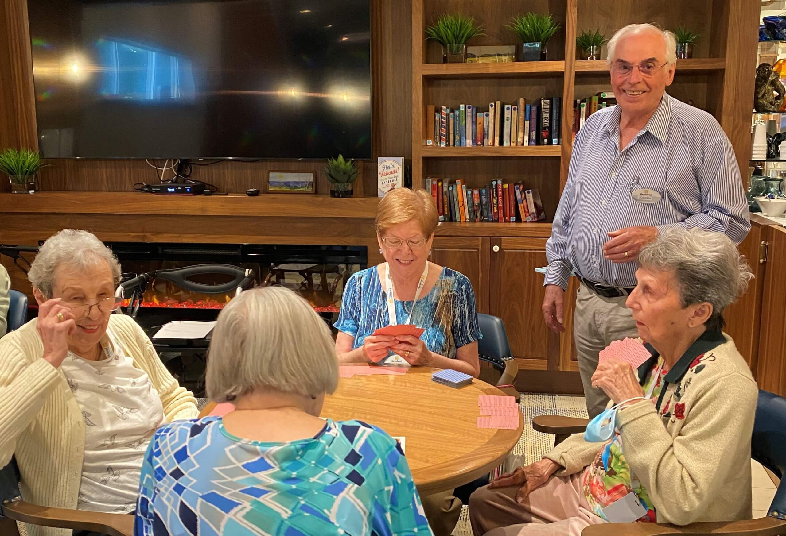 Resident Joseph Tillie teaching bridge to a group