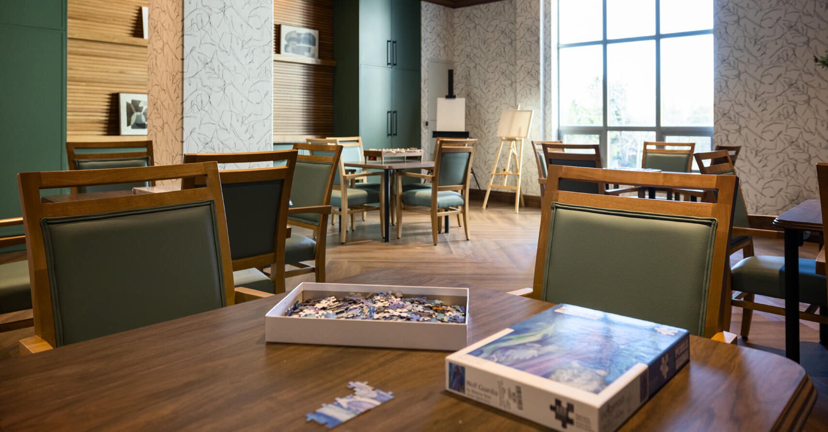 Photograph of a games room, with a puzzle box on a table.